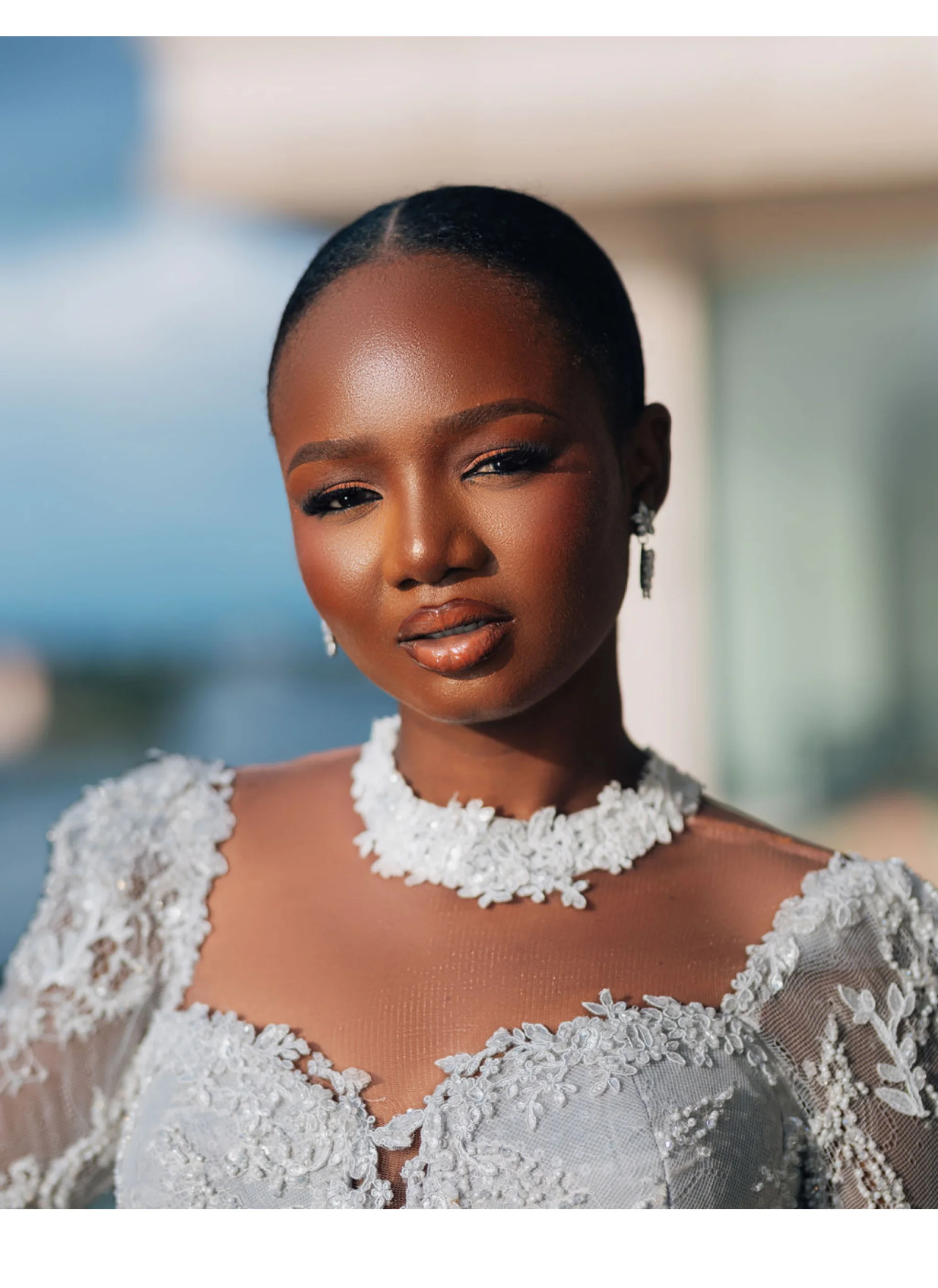 Close-up portrait of a bride in a beaded lace high-neck gown