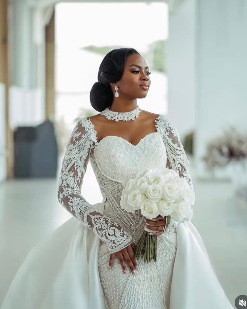 Model wearing a structured white bridal gown